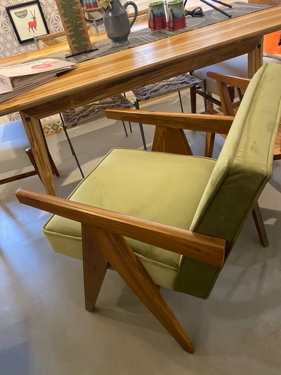 Mid-century chair beside a teak table