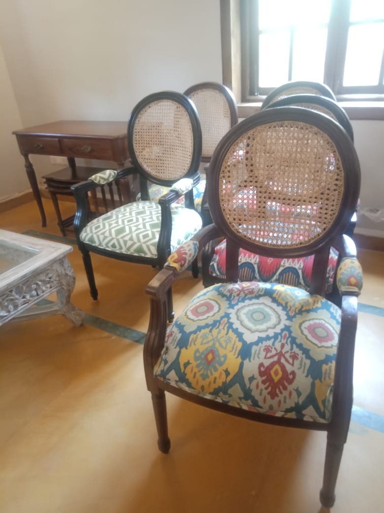 Cane chairs with patterned upholstery